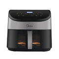 A lit-up view through the Midea air fryer's transparent window while cooking, allowing for easy monitoring without losing heat.