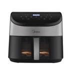 A lit-up view through the Midea air fryer's transparent window while cooking, allowing for easy monitoring without losing heat.