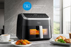 Internal light illuminating the 8.5L Midea MF-CY85WK2 air fryer basket through the observation window during cooking.