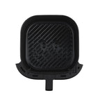 The large 5.5-liter non-stick basket of the Midea air fryer, perfectly sized for family meals and whole chickens.